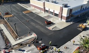 Commercial asphalt paving project with fresh blacktop and curbing in Latham NY