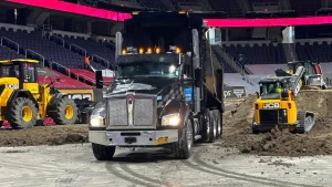 J. Hunziker Asphalt Paving team inside MVP Arena in Albany, NY, during a Monster Truck event