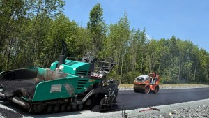J. Hunziker asphalt paver laying a smooth new surface on a road in Stuyvesant, NY