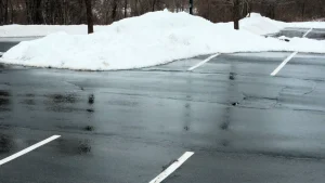 Snow cleared from a commercial parking lot by J. Hunziker Paving