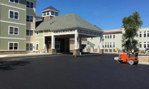 Fresh asphalt paving outside commercial building in Rensselaer NY